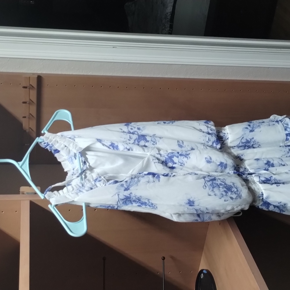 Justify small white with blue floral print.